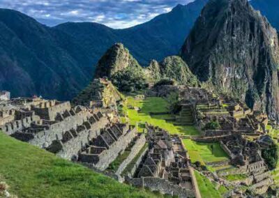 Panoramic view of Machu Picchu ruins surrounded by mountains